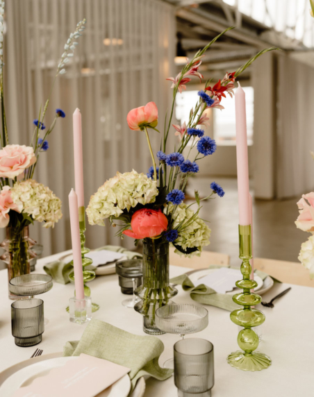 Table styling at The Button Factory, featuring table linenm, florals and candle holders.